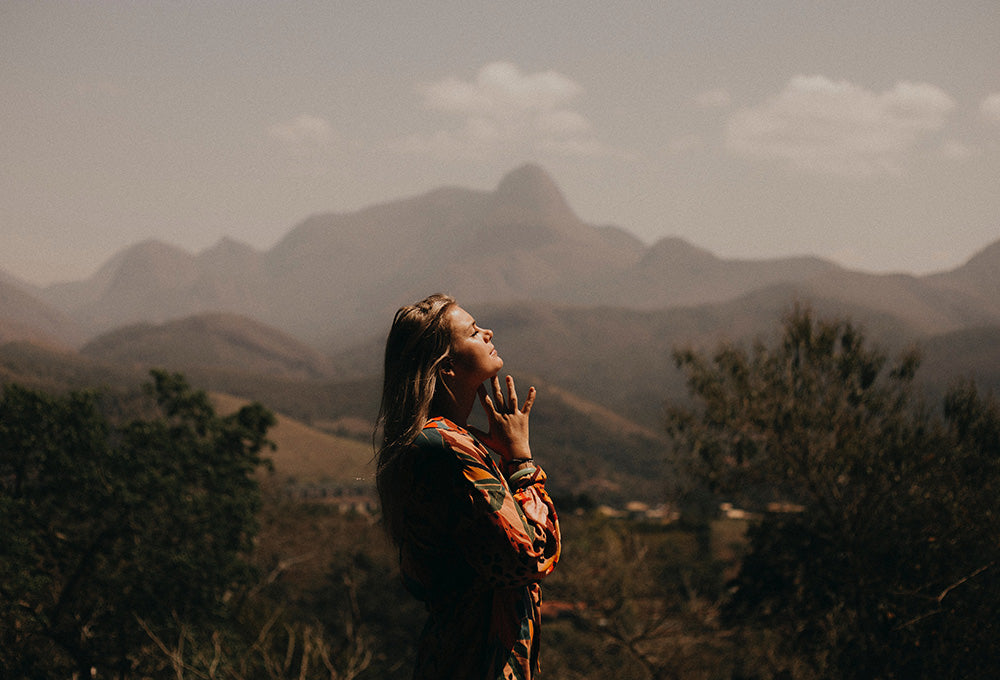 Woman looking to the sky symbolizing forgiveness and mercy
