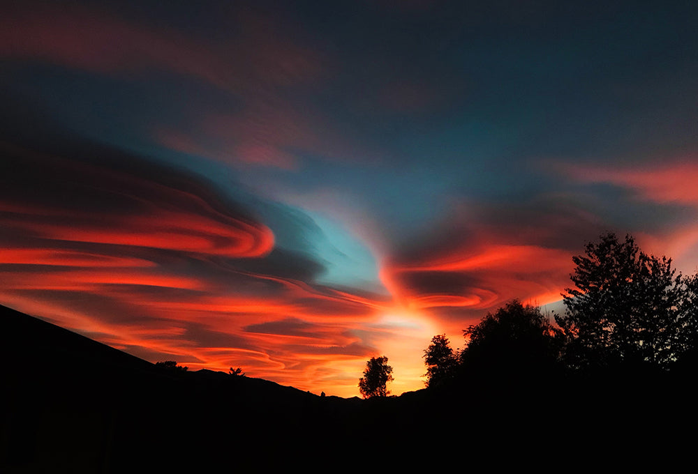 Scenic sunset over hills and forest reflecting on rest that can be found with Him
