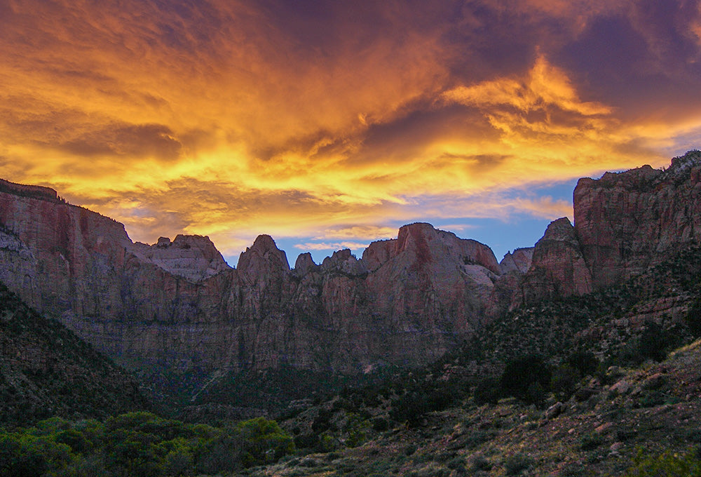 Scenic mountain with sunset and orange skies that show God is our refuge and strength