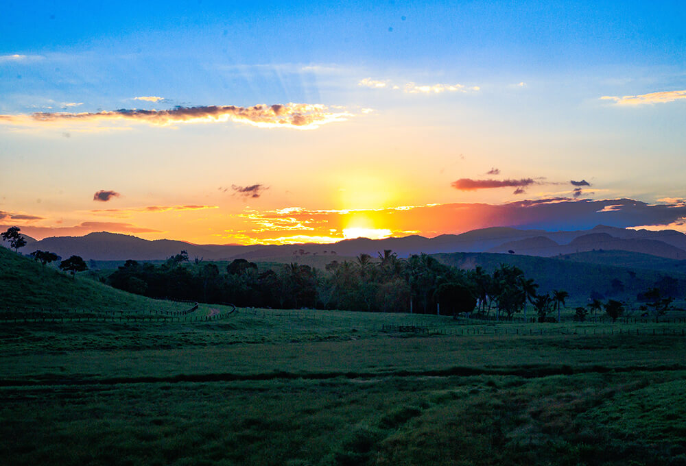 sunrise over the green scenic hills inspiring reflection and inspiration in God