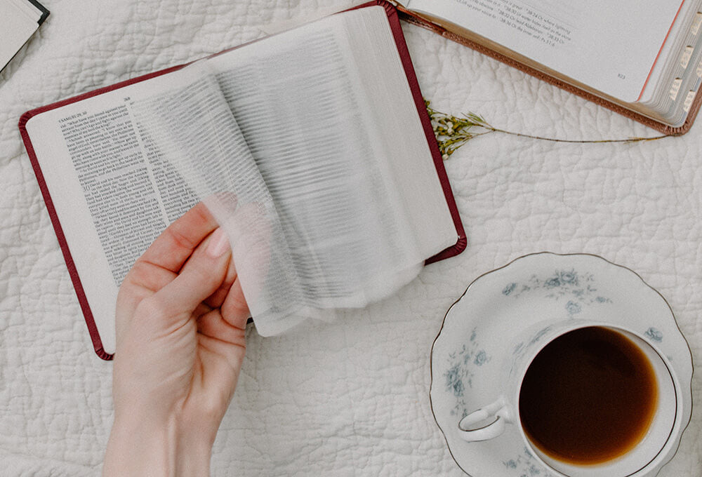 Women spending her morning reading scriptures from the Bible