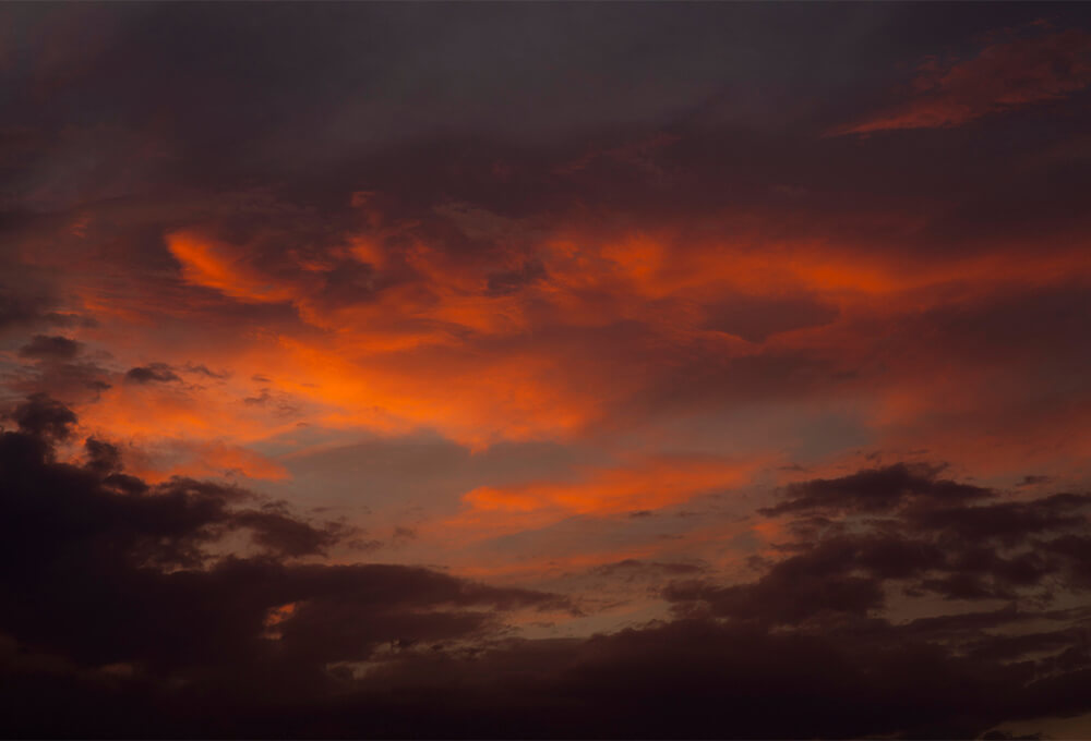Sky transitioning from darkness to sunrise as a symbol of renewed hope