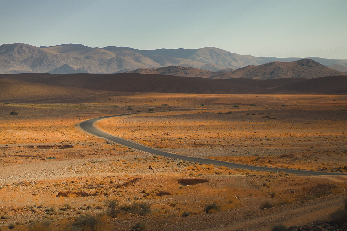 A winding path through an open landscape, symbolizing God's guidance and hope for a new season.