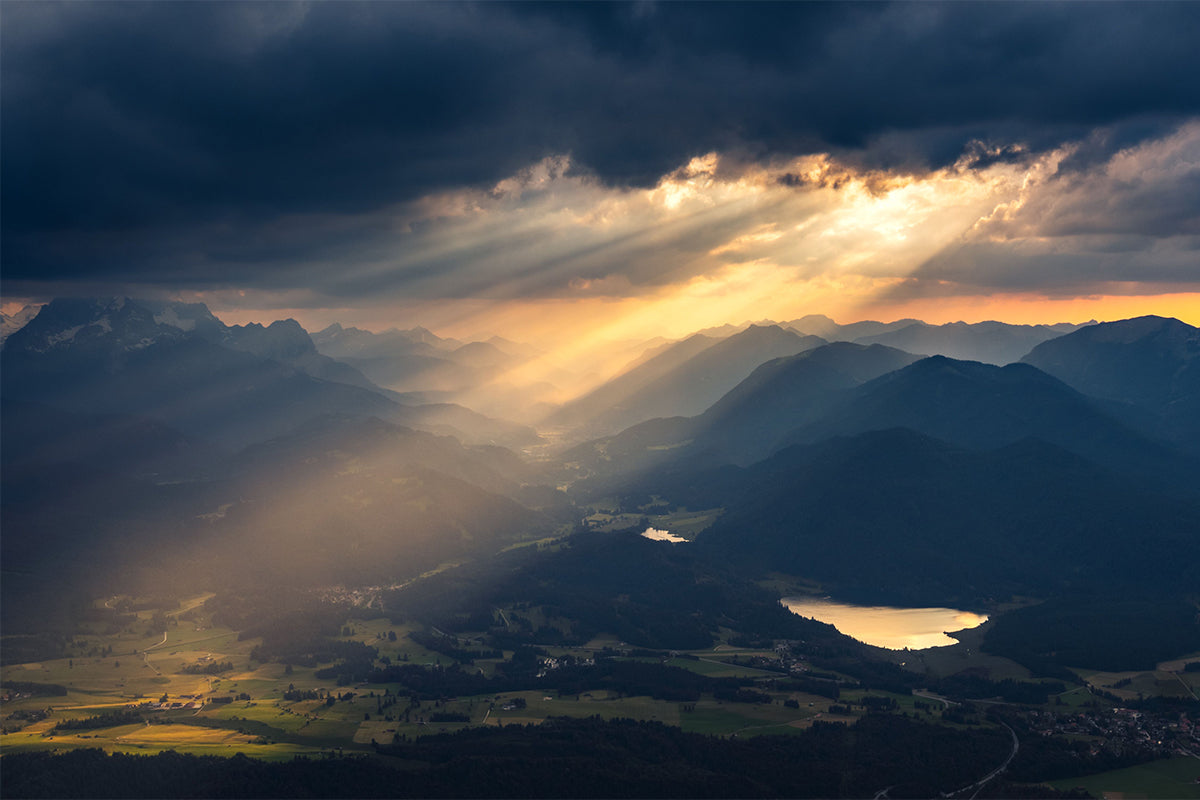 Sunlight breaking through clouds over a peaceful landscape, symbolizing hope and strength through faith.