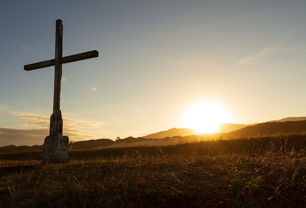 Sunlight streaming through cross symbolizing grace and renewal
