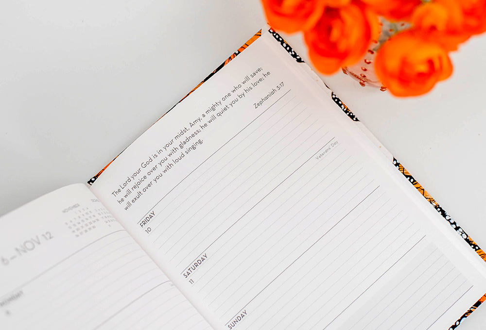 Open personalized scripture planner symbolizing committing plans to God