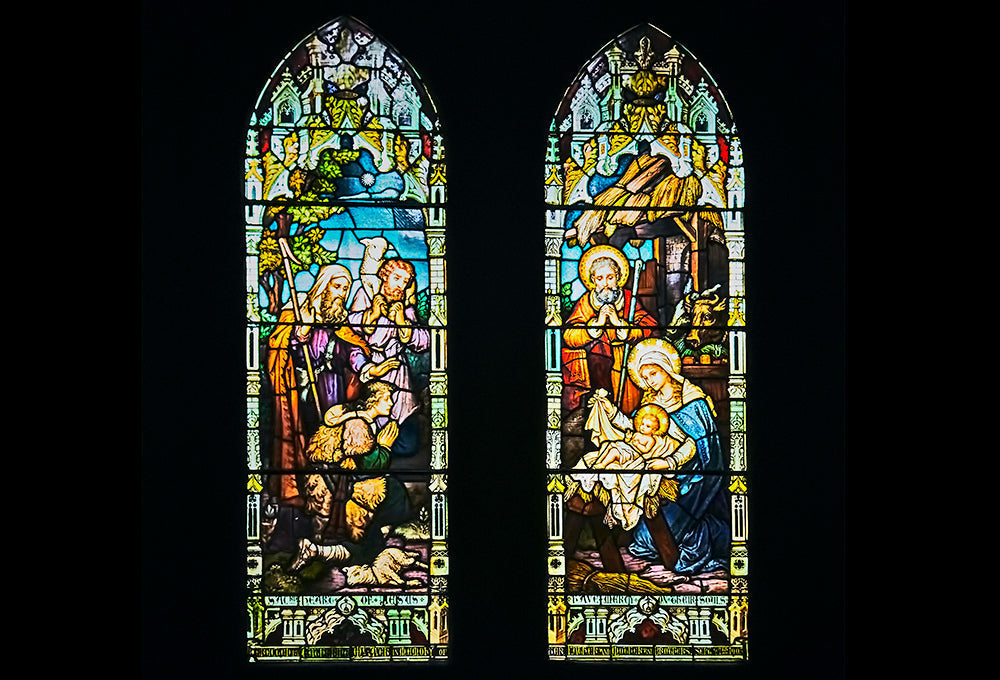 Stained glass windows representing light going through and God with us