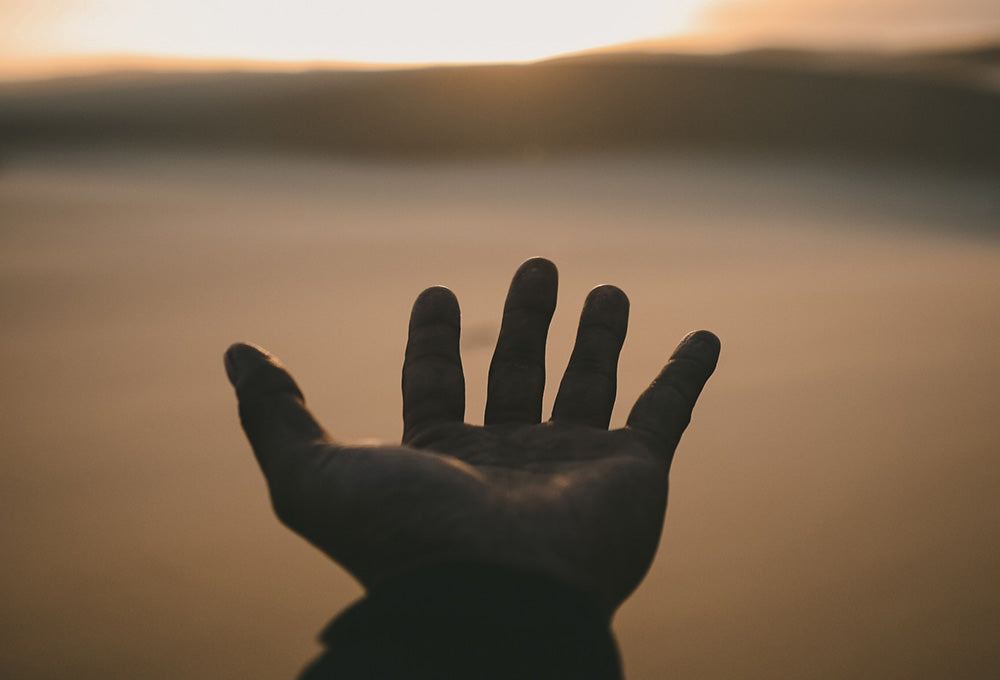 Hands gently open symbolizing being engraved on His hands
