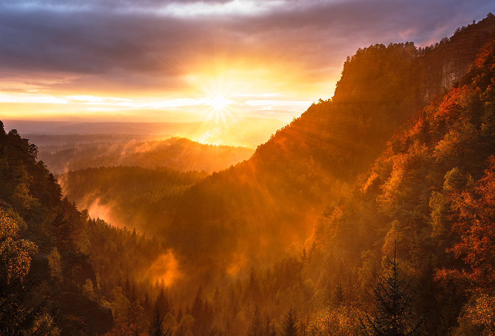 Morning sunshine beams through majestic mountains