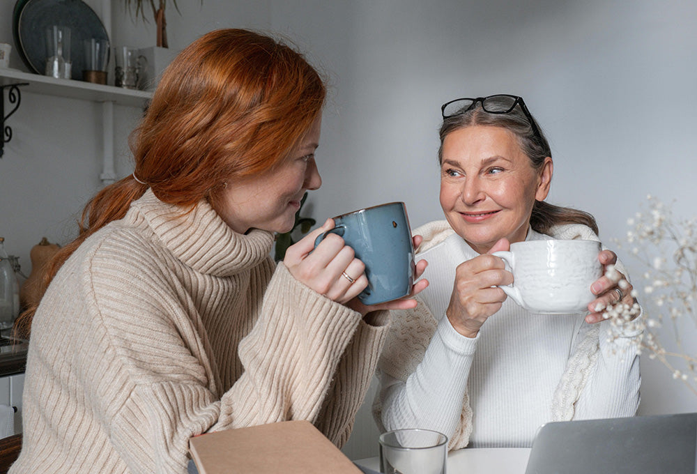 Good friends talking over coffee warm light encouragement