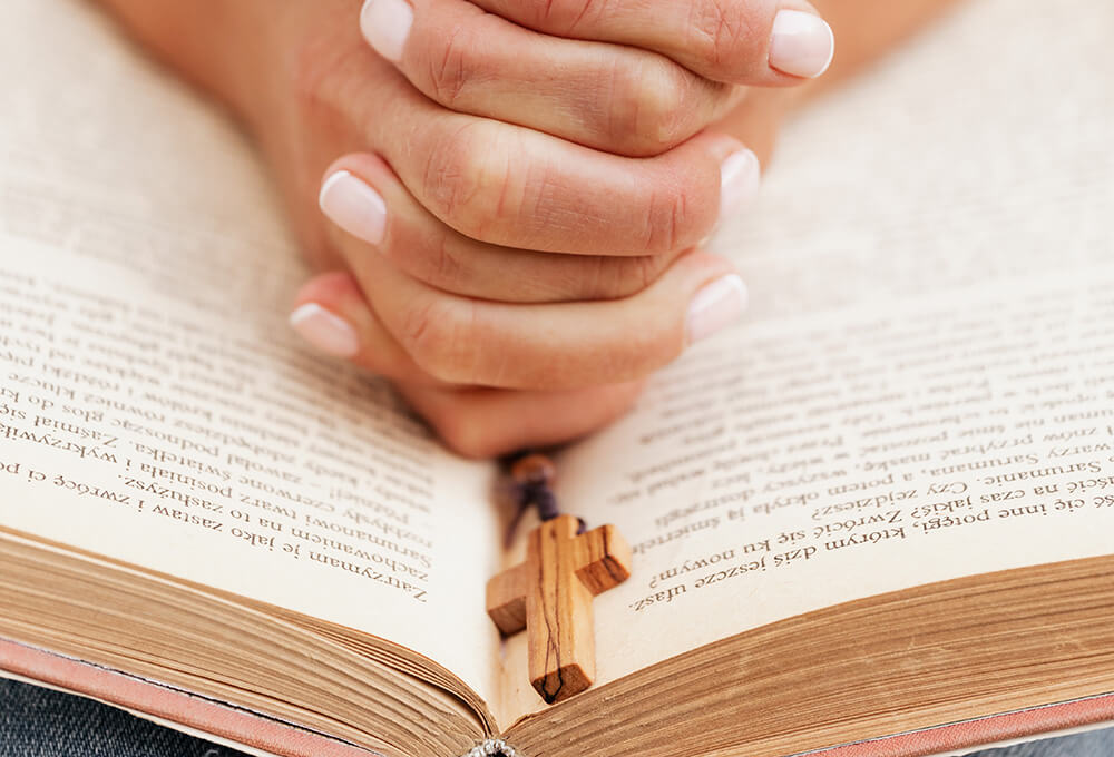 Personalized scripture journal open during private prayer