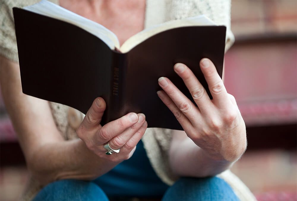 Woman reading the Bible