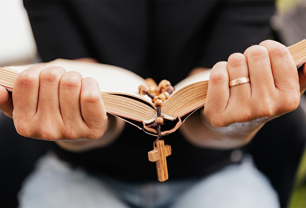 Woman holding an open Bible