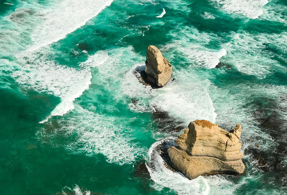 ocean waves with rock symbolizing stability versus instability
