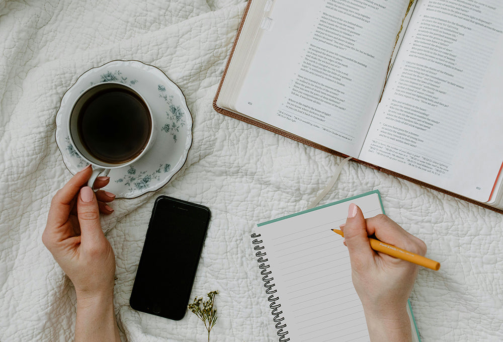 Workspace with coffee, bible, and Paper Sunday journal