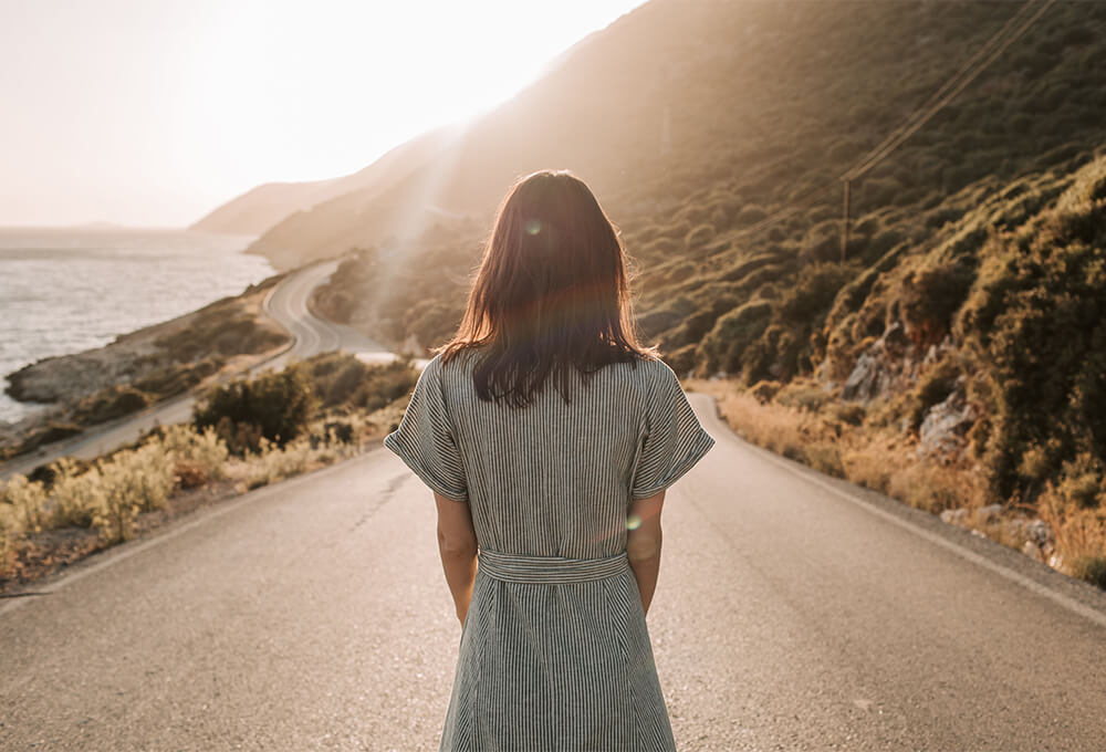 Woman looking toward a new path as a symbol of God's new work in her life
