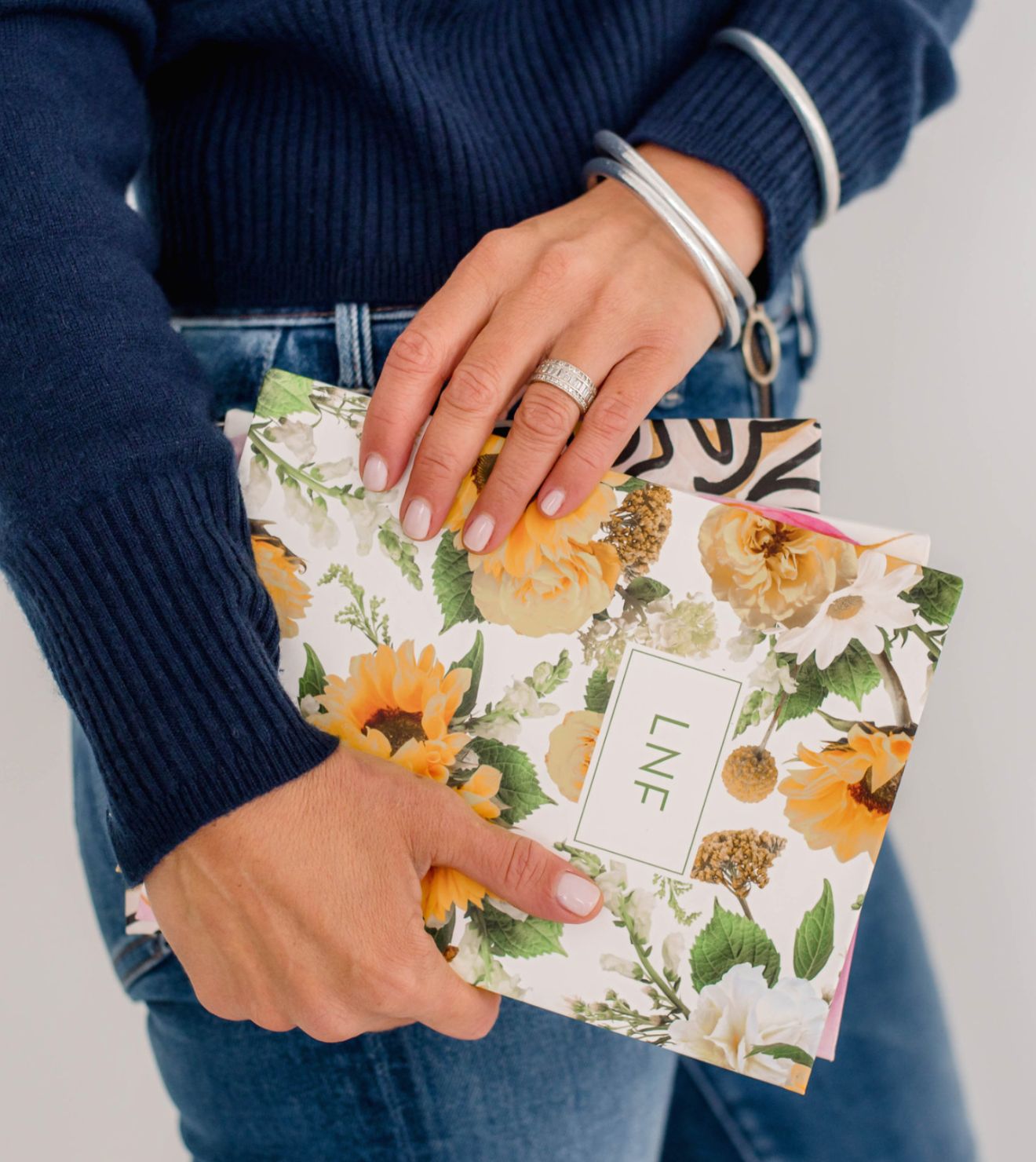 woman holding a beautiful personalized christian planner in a sunflower design