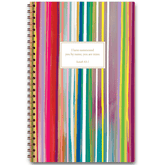 A colorful planner with abstract patterns and a quote from the Bible on the cover, designed by Allison Castillo.