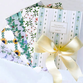 Collection of personalized Bible journals with artist-designed covers by Paper Sunday, featuring multiple styles and one-of-a-kind curated scripture selections