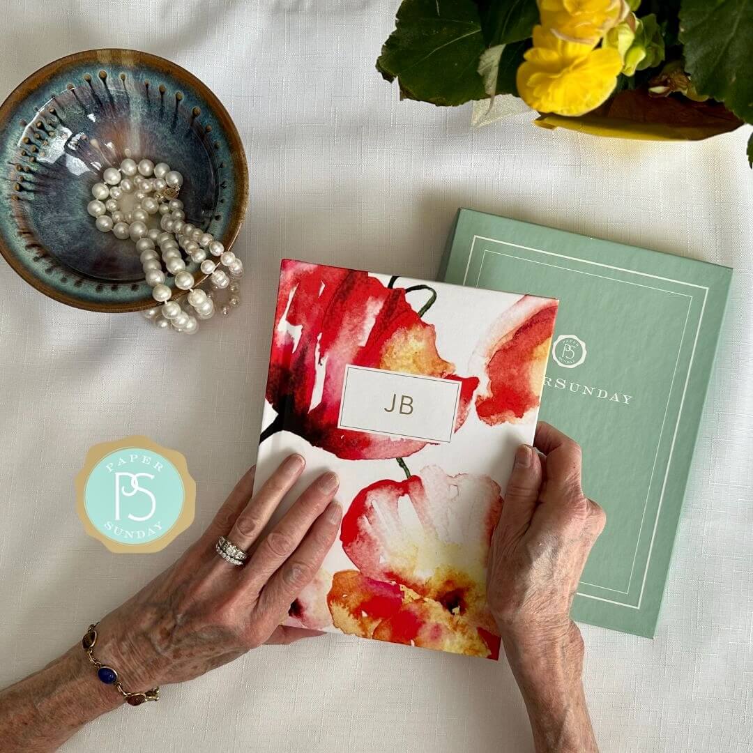 Mother s hands holding a beautiful Softcover personalized Bible journal with Red Floral artwork, featuring a one-of-a-kind selection of scriptures for quiet time, prayer, and devotional writing