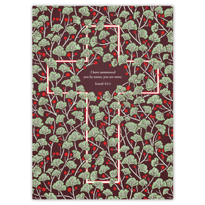 A planner cover featuring a red and green foliage pattern with a central cross design and text from Isaiah 43:6.