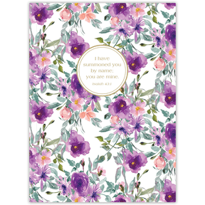 A journal cover featuring a floral design with purple flowers and a central text circle that contains personalized scripture verse.